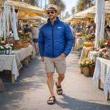 Man walking through an outdoor market wearing an AeroVent jacket