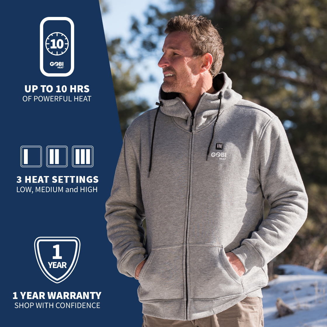 A man wearing GOBI's men's ridge heated hoodie. He is placed in front of a landscape, with information about the product on the left side of the image.